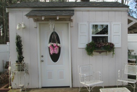 Straw Handbag Planter - attractive garden shed with purse planter hanging on the door