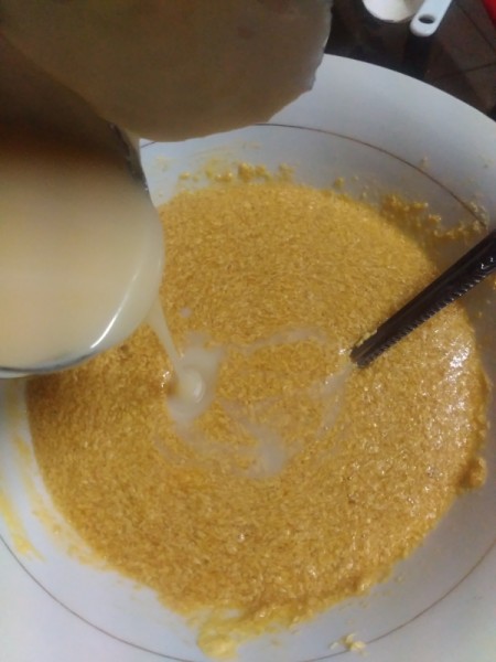 adding milk to batter