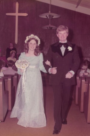 A couple walking down the aisle at their wedding.