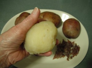 A cooked potato that has had the skin removed.