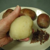 A cooked potato that has had the skin removed.