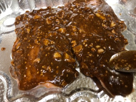 covering salmon with almond sauce