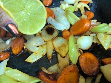 adding lemon & soy sauce to veggies