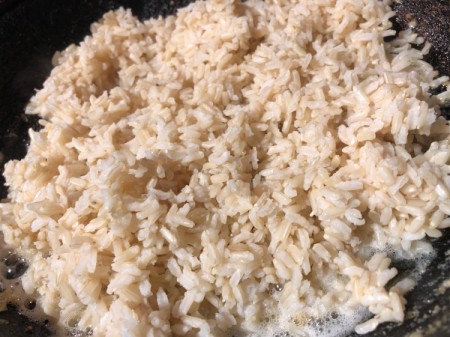 Rice added to pan