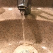 A faucet with running water.