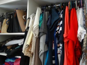 A crowded clothes closet.