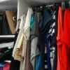 A crowded clothes closet.
