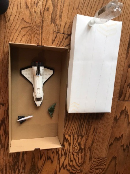 Toy Helicopter/Airplane Landing Pad - using the bottom portion of the  box as a garage