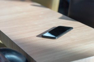 A cell phone sitting on a table or countertop.