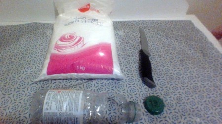 Using a recycled bottle and cap to seal powdered sugar.
