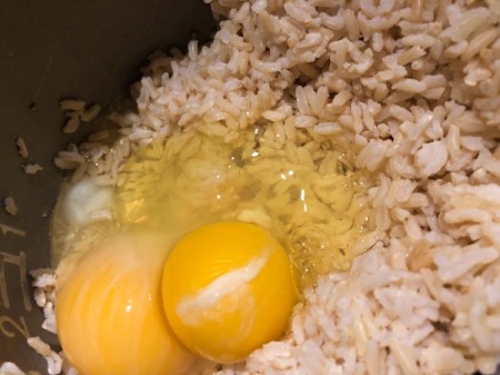 adding eggs to rice
