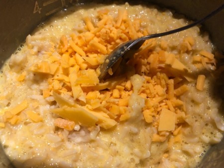 adding cheese to rice & egg
