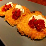 Rice Pancakes on plate with sour cream & salsa