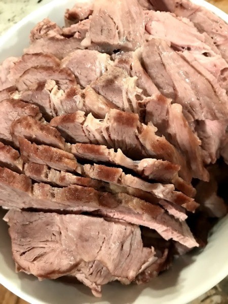 cutting cooked pork roast