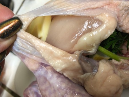 garlic under skin of Cornish Game Hens