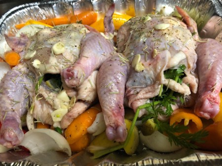 Cornish Game Hens in baking pan with veggies