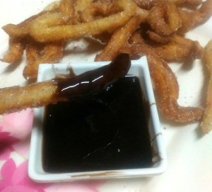 Homemade Mini Churros with chocolate syrup