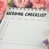 Wedding checklist surrounded by flowers.