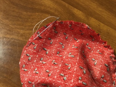 Bottlecap Pincushion -  sew a running stitch around the edge of the larger circle