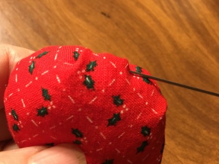 Bottlecap Pincushion - adjust the stuffing with a needle