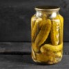 A jar of pickles in juice.