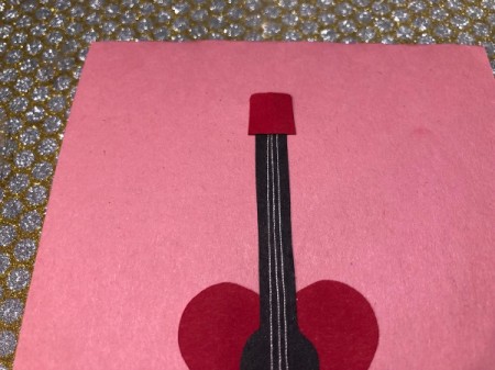 Guitar Heartstrings Card - pull strings taut and glue the head down on the top of the neck