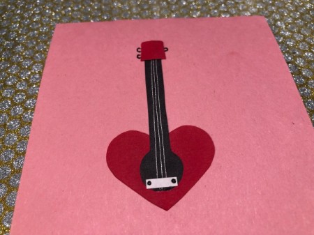 Guitar Heartstrings Card - cut a piece of white paper and glue in place as the bridge, add screws with a pen, draw tuning pegs on the head