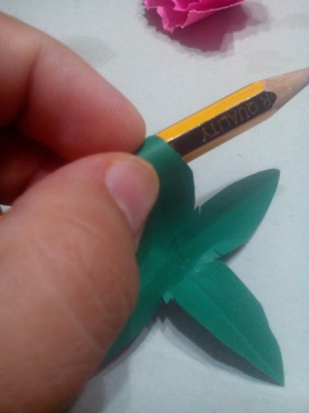 Paper Carnation Wreath - roll the leaf tips back around a pencil