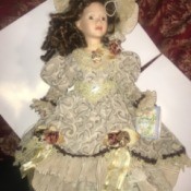 Value of a Limited Edition Cathay Depot Doll - doll in lace dress with matching hat