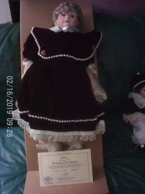 Value of a Karnival Kids Collection Porcelain Doll - doll in black dress with very large collar