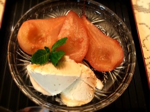 Poached Pears with ice cream on plate
