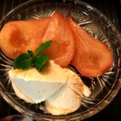 Poached Pears with ice cream on plate