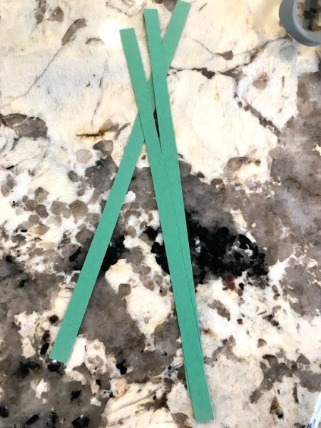 Carrot Counting Activity for Toddlers - cut strips of green paper for the leaves