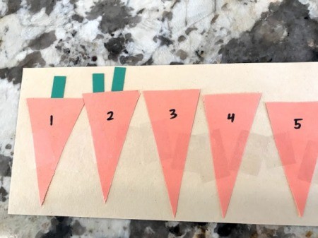 Carrot Counting Activity for Toddlers -  leaves in pockets 1 and 2