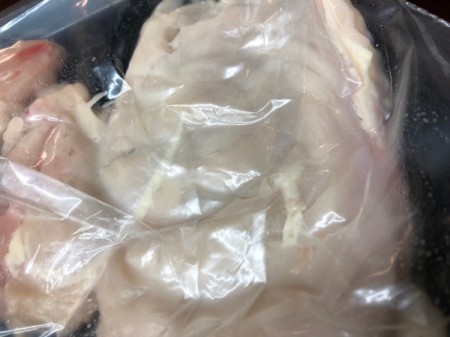 cut chicken strip in bag