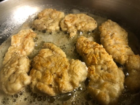 battered chicken frying