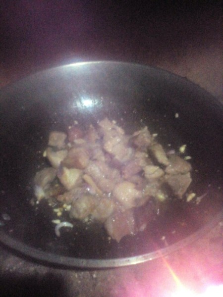 cooking pork with onions, garlic and ginger