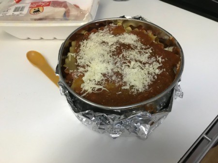 cheese on sauce in pan