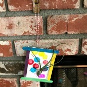 Making a Hanging Air Plant Frame - hanging on a brick fireplace