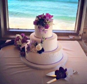 A beautiful cake at an beach wedding.