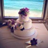A beautiful cake at an beach wedding.