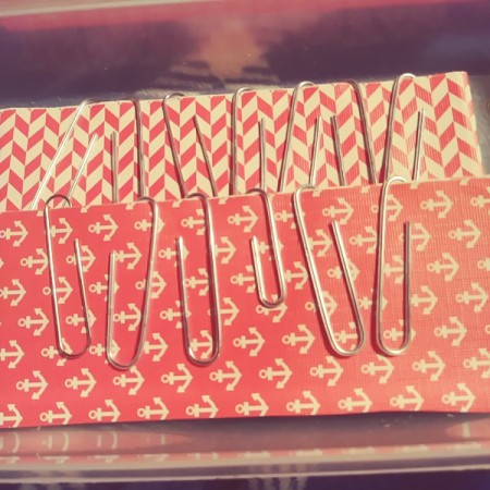 Paper clips on the edge of a homemade journal.