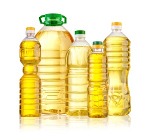 Different sized bottles of cooking oil.