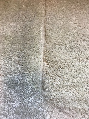 A dent caused by furniture in wall to wall carpet.