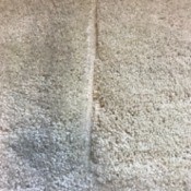 A dent caused by furniture in wall to wall carpet.