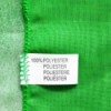 A clothing tag that reads 100% polyester.