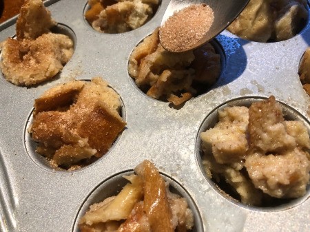 cinnamon sugar on top of bread in cups