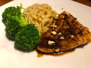 Honey Garlic Salmon with pasta & broccoli on plate