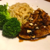 Honey Garlic Salmon with pasta & broccoli on plate