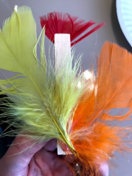 Clothespin Chicken Plant Decoration - two feathers both at angles on back of pin